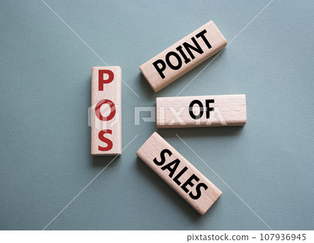POS - Point Of Sales symbol. Wooden cubes with words POS. Beautiful grey green background. Business and POS concept. Copy space. POS - Point Of Sales symbol. Wooden cubes with words POS. Beautiful grey green background. Business and POS concept. Copy space. 107936945