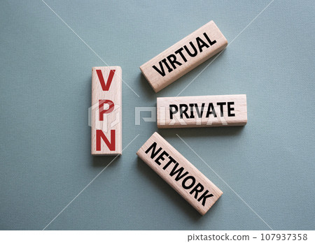 VPN - Virtual Private Network. Wooden cubes with word VPN. Beautiful grey green background. Business and VPN concept. Copy space. 107937358