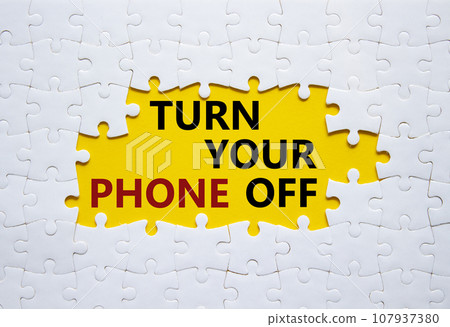 Turn Your Phone off symbol. White puzzle with words Turn Your Phone off. Beautiful yellow background. Business concept. Copy space. Turn Your Phone off symbol. White puzzle with words Turn Your Phone off. Beautiful yellow background. Business concept. Copy space. 107937380