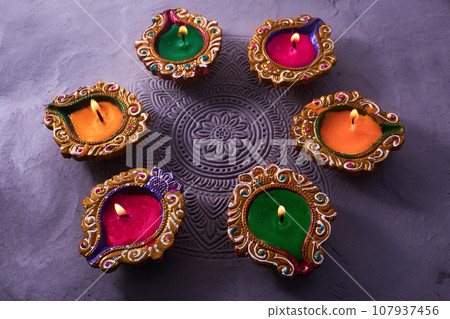 Burning diya on Happy Diwali, background for light festival of India 107937456