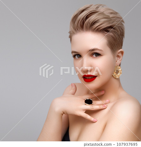 Beautiful girl with set jewelry . Woman with a Beautiful girl with set jewelry . Woman with a 107937695