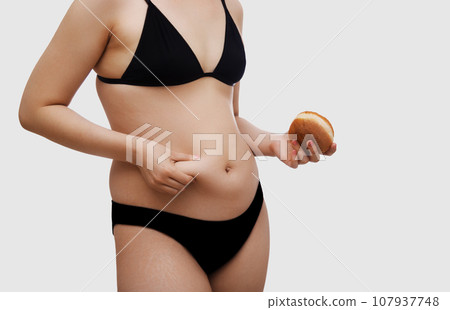 Junk food. Fat belly, girl. Sport and healthy Junk food. Fat belly, girl. Sport and healthy 107937748