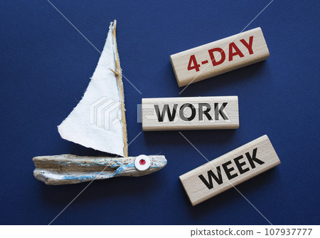 4-day work week symbol. Concept words 4-day work week on wooden blocks. Beautiful deep blue background with boat. Business and 4-day work week concept. Copy space 4-day work week symbol. Concept words 4-day work week on wooden blocks. Beautiful deep blue background with boat. Business and 4-day work week concept. Copy space 107937777