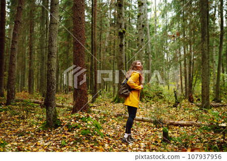 Young woman explores new, fantastic places around world, surrounded by nature relax Active Lifestyle 107937956