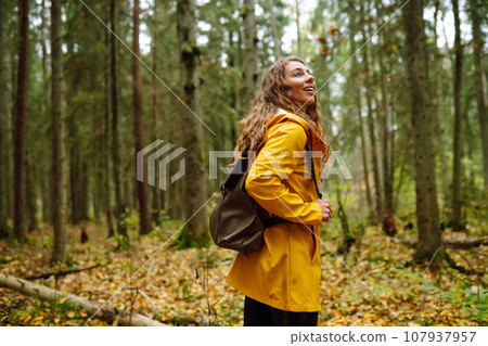 Young woman explores new, fantastic places around world, surrounded by nature relax Active Lifestyle 107937957