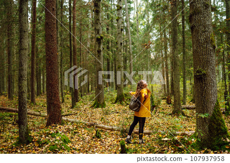 Young woman explores new, fantastic places around world, surrounded by nature relax Active Lifestyle 107937958