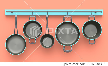 Set of stewpot, frying pan and chrome plated cookware hanging on shelf on pink 107938393