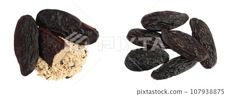 Tonka bean isolated on white background with full depth of field. Bean of Dipteryx odorata, Top view. Flat lay Tonka bean isolated on white background with full depth of field. Bean of Dipteryx odorata, Top view. Flat lay 107938875