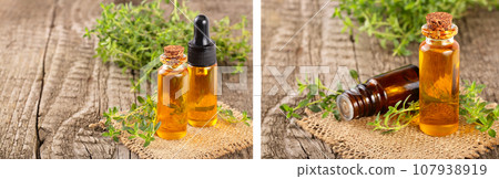Bottle of essential oil with herbs thyme isolated on white background Bottle of essential oil with herbs thyme isolated on white background 107938919