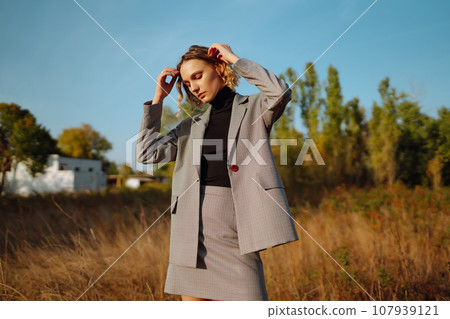 Portrait of elegant, luxury woman posing in nature. People, relaxation and vacations concept. 107939121