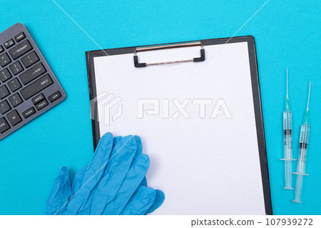 Vaccination or Revaccination Concept - Two Medical Syringe on Blue Table 107939272