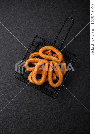 Delicious sweet churos with powdered sugar and cream inside Delicious sweet churos with powdered sugar and cream inside 107940140