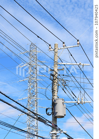 Electric wires, utility poles, and power transmission towers 107940425