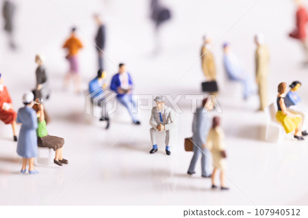 Businessman sitting alone in the crowd Businessman sitting alone in the crowd 107940512