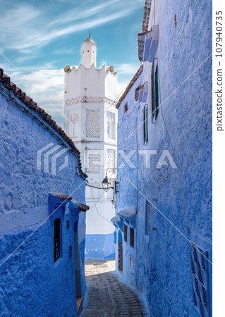 Chefchaouen town in Morocco, known as the Blue Pearl, famous for its striking blue color painted medina buildings and streets, creating a unique and magical atmosphere. Chefchaouen town in Morocco, known as the Blue Pearl, famous for its striking blue color painted medina buildings and streets, creating a unique and magical atmosphere. 107940735