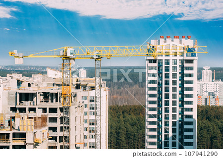 Amazing Bright Blue Sky Above Construction Crane. New Accommodation Concept. Construction And Development Of New Multi-storey Residential. Conception Of Development 107941290