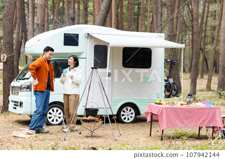 Couple enjoying camping Couple enjoying camping 107942144