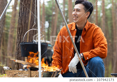 Men enjoying camping Men enjoying camping 107942173