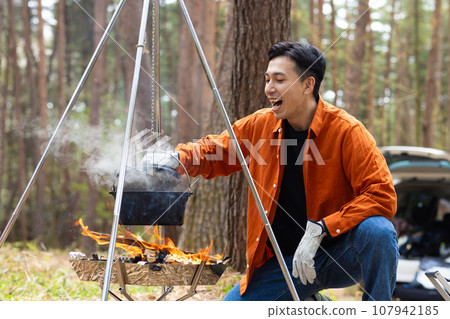 Men enjoying camping Men enjoying camping 107942185