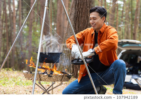 Men enjoying camping Men enjoying camping 107942189
