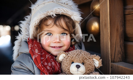 Cute Young Toddler Girl Dressed for a Snowy Christmas Holding Her Teddy Bear. Generative AI. 107942243