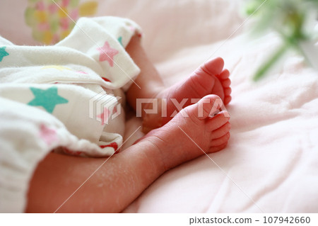 Cute baby feet 107942660