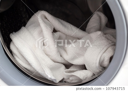 Used towel in washing machine Used towel in washing machine 107943715