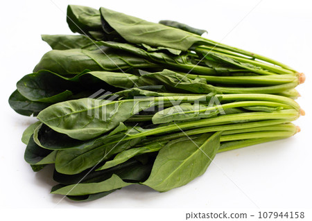 Fresh spinach on white background Fresh spinach on white background 107944158