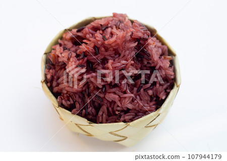Black sticky rice on white background. 107944179