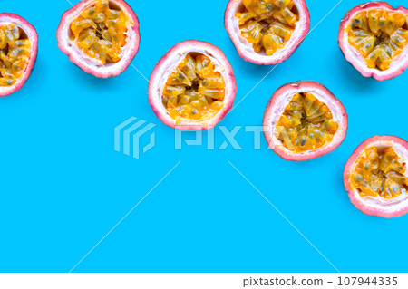 Passion fruit on blue background. Passion fruit on blue background. 107944335
