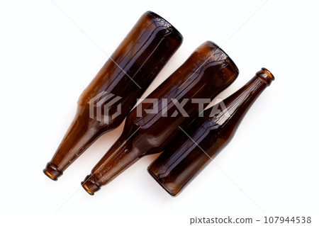 Empty brown bottles on white background. Empty brown bottles on white background. 107944538