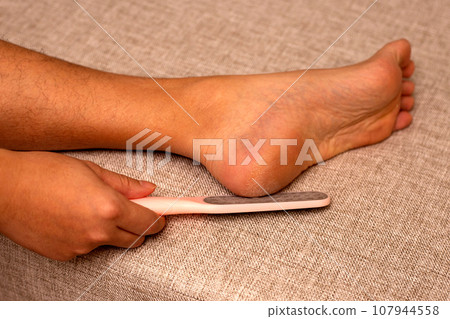 Foot with foot file, Cleansing the heel 107944558