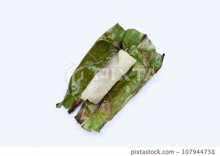 Grilled sticky rice in banana leaves with banana filling 107944738