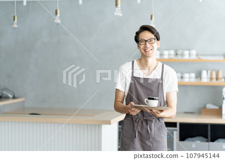 Male clerk working at a cafe 107945144
