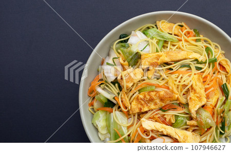 Chinese-styled fried noodle. Asian cuisine 107946627