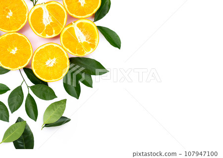 Orange fruit with green leaves on white background. Orange fruit with green leaves on white background. 107947100