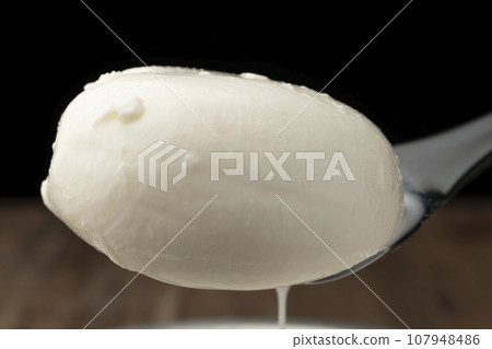 Burrata cheese spoon up Burrata cheese spoon up 107948486