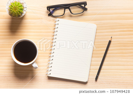 wood desk office with laptop, smartphone and other work supplies with cup of coffee. Top view with copy space for input the text. Designer workspace on desk table essential elements on flat lay.. wood desk office with laptop, smartphone and other work supplies with cup of coffee. Top view with copy space for input the text. Designer workspace on desk table essential elements on flat lay.. 107949428