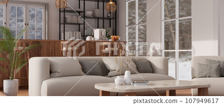 Luxury modern living room with a couch, a coffee table, a wooden counter bar and stools in the back Luxury modern living room with a couch, a coffee table, a wooden counter bar and stools in the back 107949617