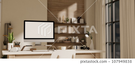 A modern and minimal home office workspace with a computer mockup and accessories on a table. A modern and minimal home office workspace with a computer mockup and accessories on a table. 107949838