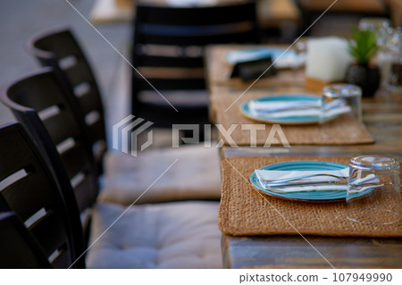Table set for an event party or wedding reception in a restaurant. 107949990