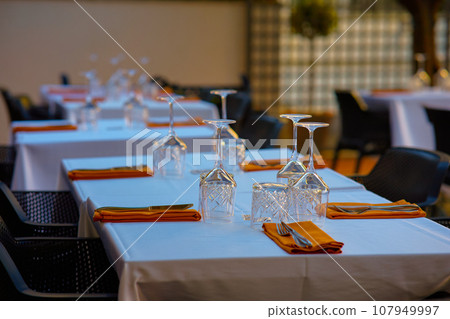 Table set for an event party or wedding reception in a restaurant. 107949997