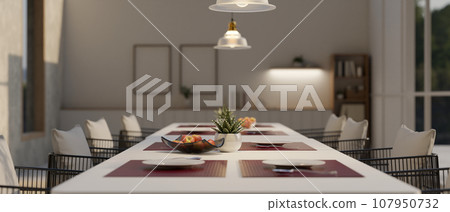 Close-up image of a dining table with a beautiful and luxurious dining table setting Close-up image of a dining table with a beautiful and luxurious dining table setting 107950732