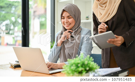 Professional Muslim business team working together, discussing on an important project Professional Muslim business team working together, discussing on an important project 107951485