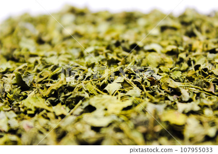 Kasuri Methi on white background with selective focus Kasuri Methi on white background with selective focus 107955033