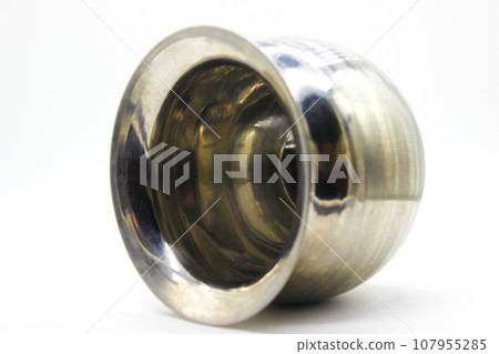 Stainless Steel Lota on white background with selective focus Stainless Steel Lota on white background with selective focus 107955285
