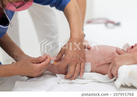 Baby beeing vaccinated by pediatrician in presence of his mother. Preventive vaccination against Diphtheria, whooping cough, tetanus, hepatitis, haemophilus influenzae, pneumococcus, poliomyelitis. 107955768