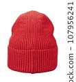 Beautiful knitted winter hat in bright red color made of wool yarn, isolated on a white background. Rear view. 107956241