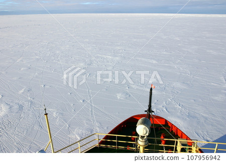 The icebreaker Nathaniel B. Palmer navigates the Antarctic Ocean covered in sea ice. 107956942
