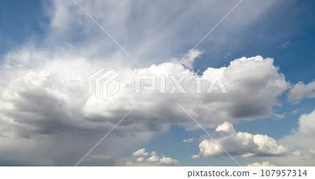 Pure summer sky with beautiful white clouds 107957314